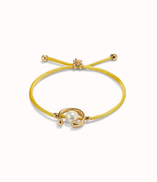 Pulsera de hilonamarillo con perla shell fornitura bañada en oro 18k.